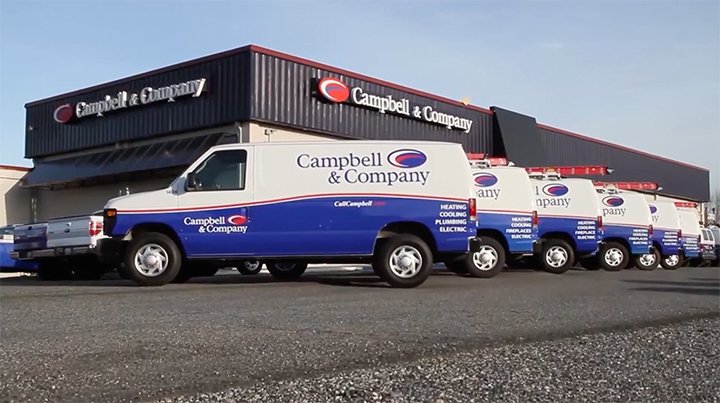 Campbell service vans parked outside of the Campbell & Company building.