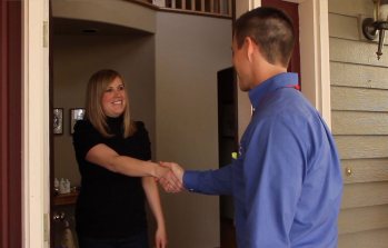 Campbell & company HVAC service technician shaking hands with homeowner