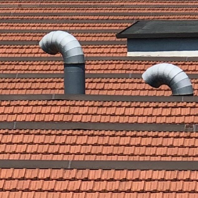 Plumbing vents on top of a roof