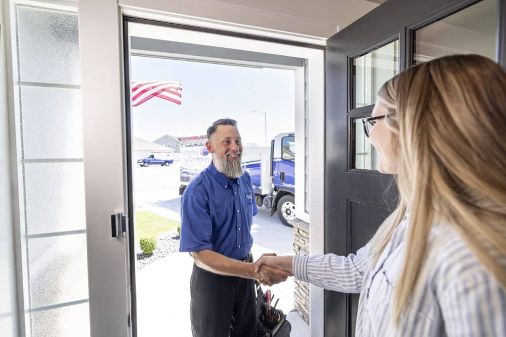 Campbell & Company employee shaking hand with homeowner